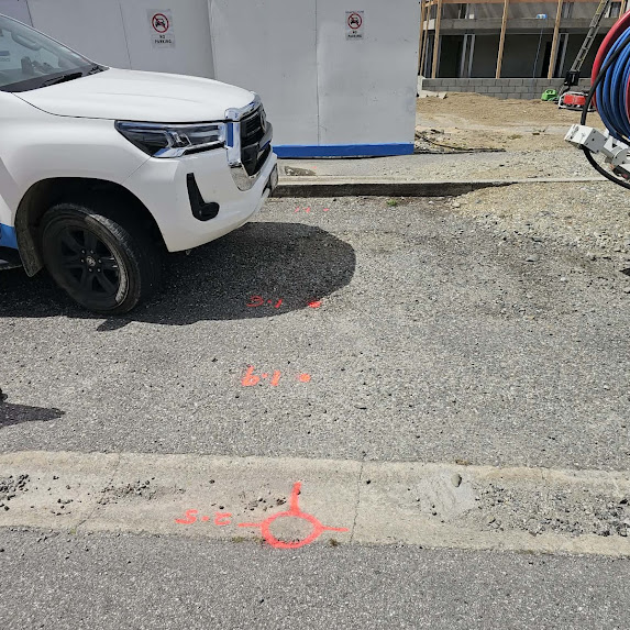 Pipe positions marked on surface with depth readings — Central Otago civil site